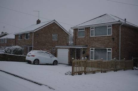 A car parked in front of a house